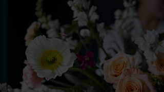 Beautiful bouquet featuring roses and white poppies, perfect for floral arrangements and decor.